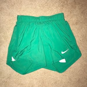 green nike shorts never worn.